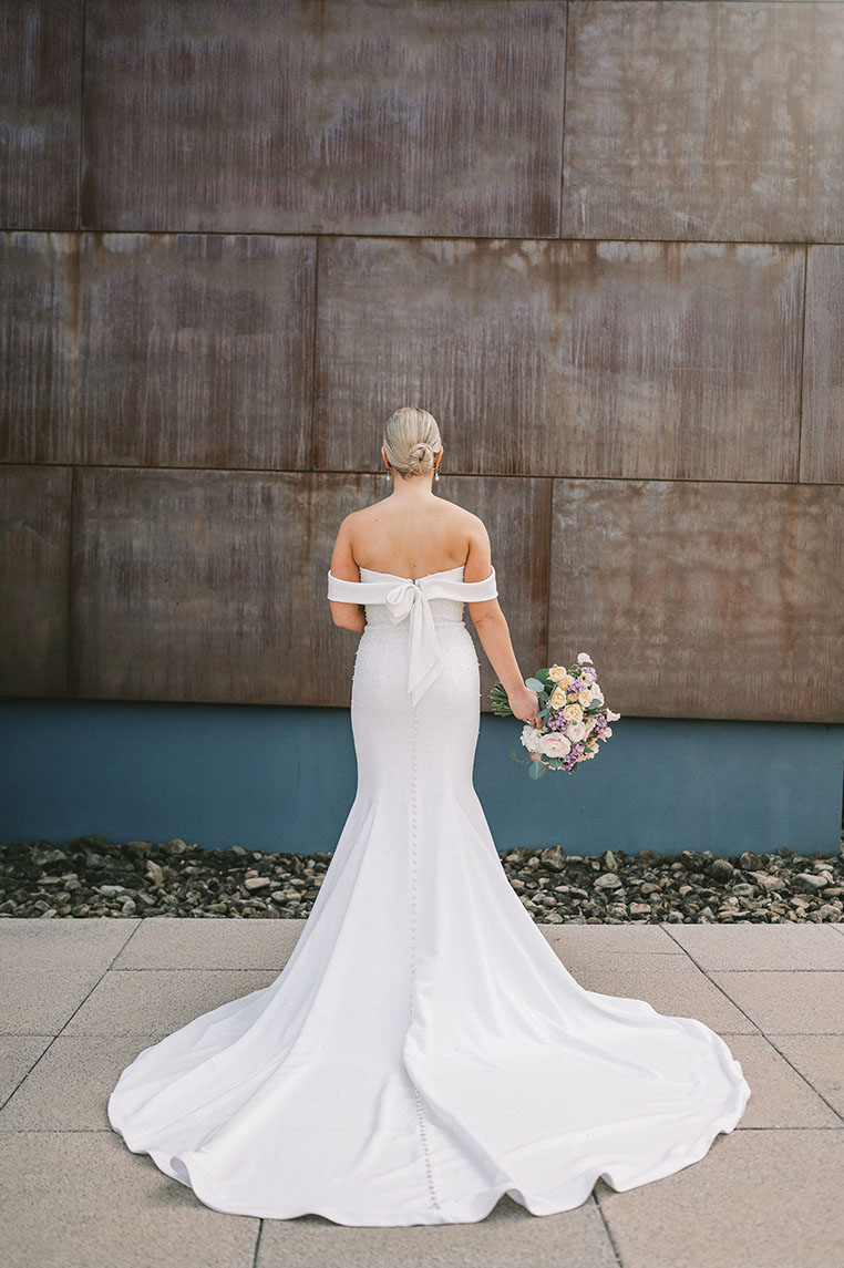 The Back of Emily's Off the Shoulder Form Fitted Bridal Gown