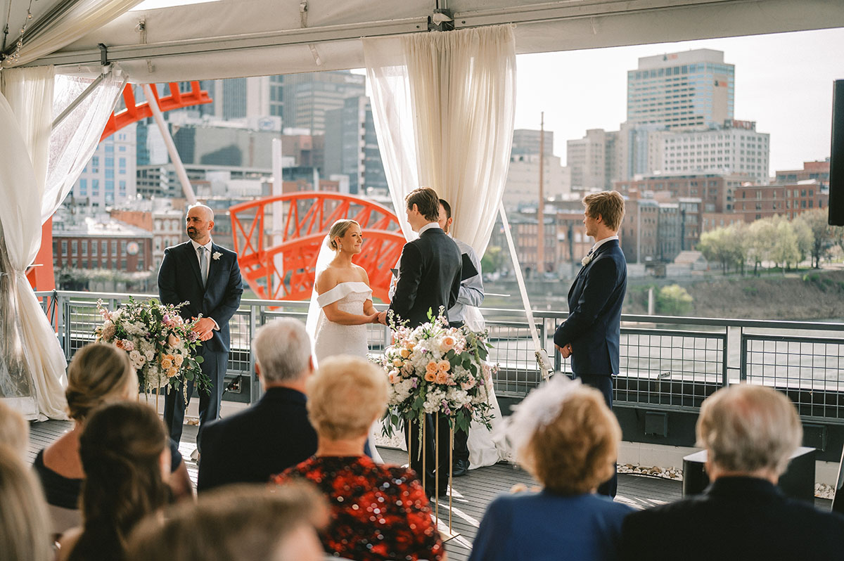 Emily and Tyler's Whimsical Wisteria Rooftop Wedding Ceremony