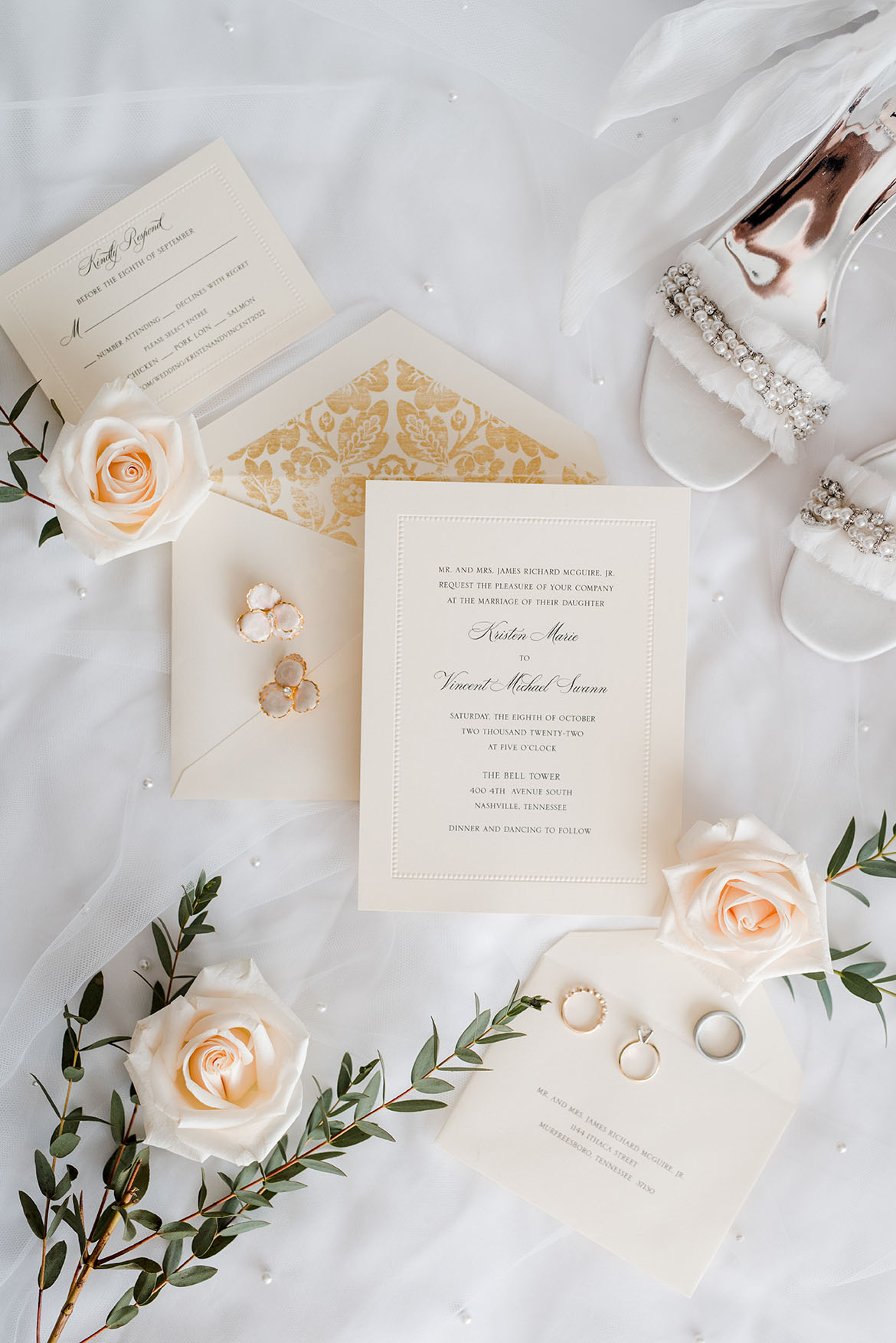 elegant white wedding invitation suite with rings and shoes