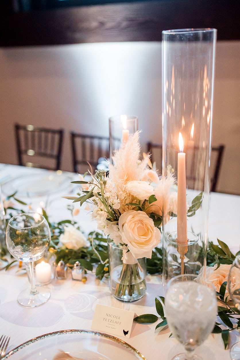 boho floral table centerpiece with tapered candle
