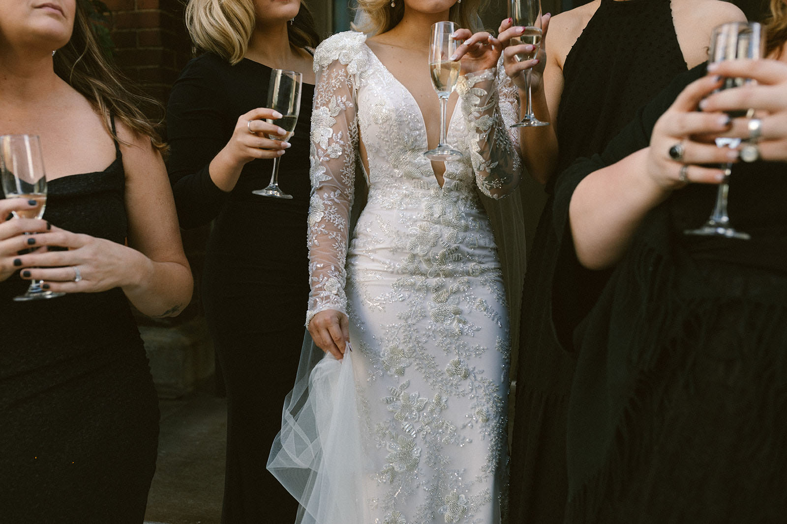 Mismatched Black Bridesmaids Dresses | Bride in Long Sleeve Lace Gown with Padded Shoulders