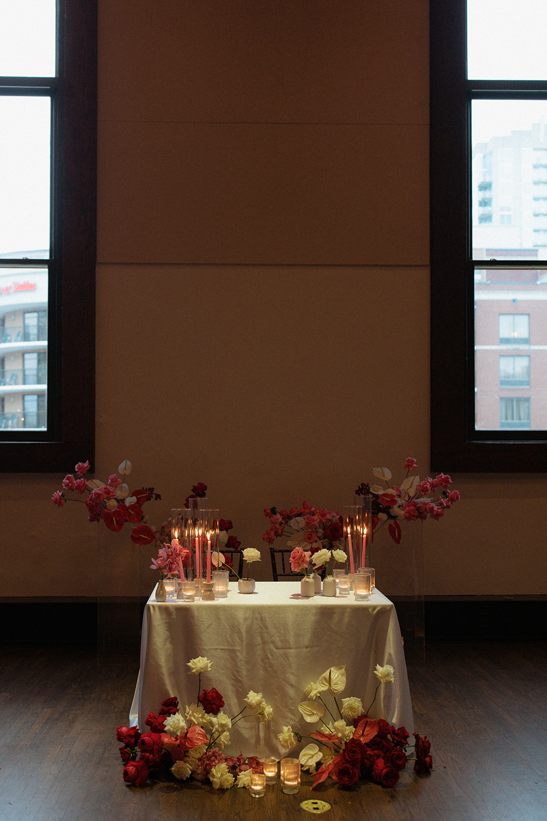 Sweetheart Table Decorated with Full Bloom Flowers in Red, Pink, and White