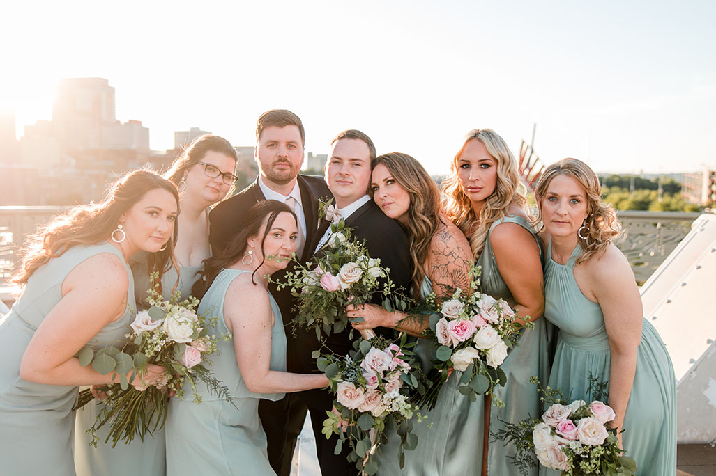 Gage and Brian with Wedding Party Dressed in Light Sage Green in Nashville