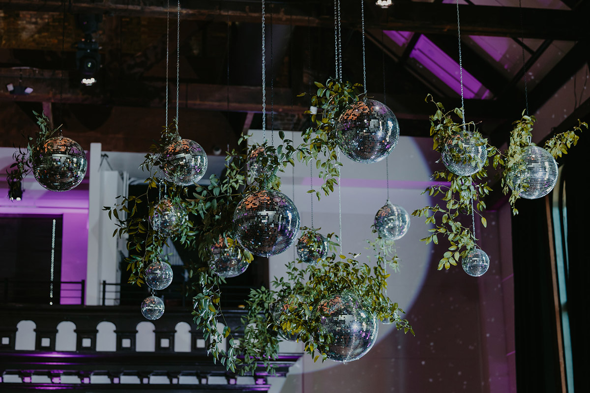 Close up of Disco Balls with Greenery at Wedding in The Bell Tower