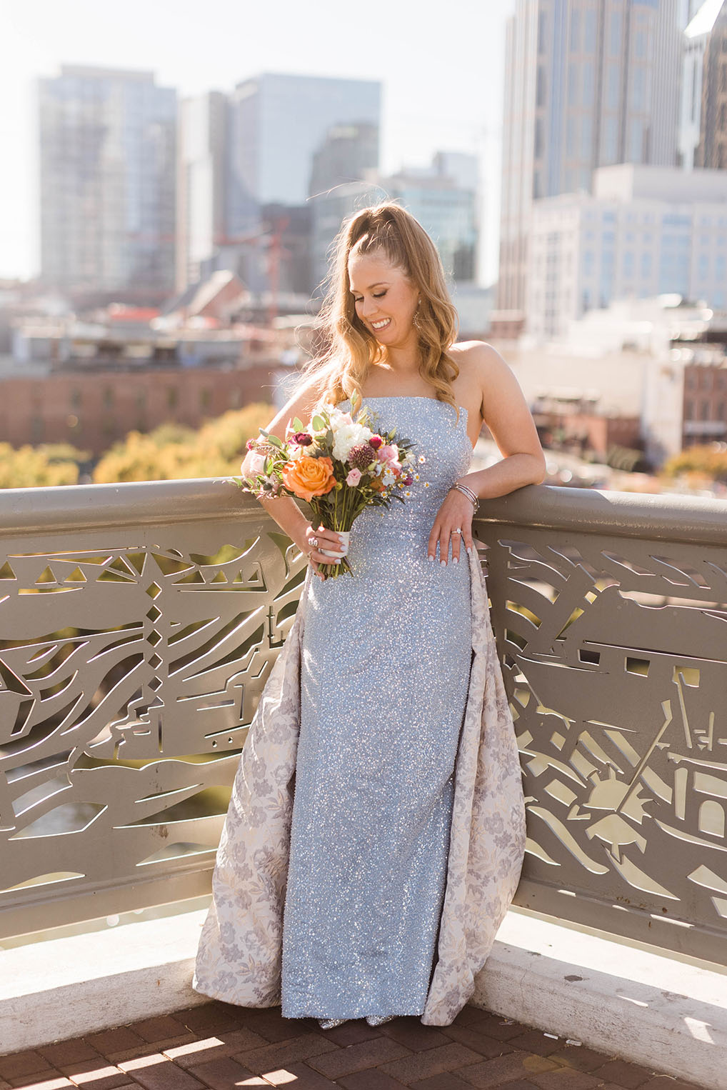 Emmy in her Blue Wedding Dress with Colorful Bouquet on Pedestrian Bridge
