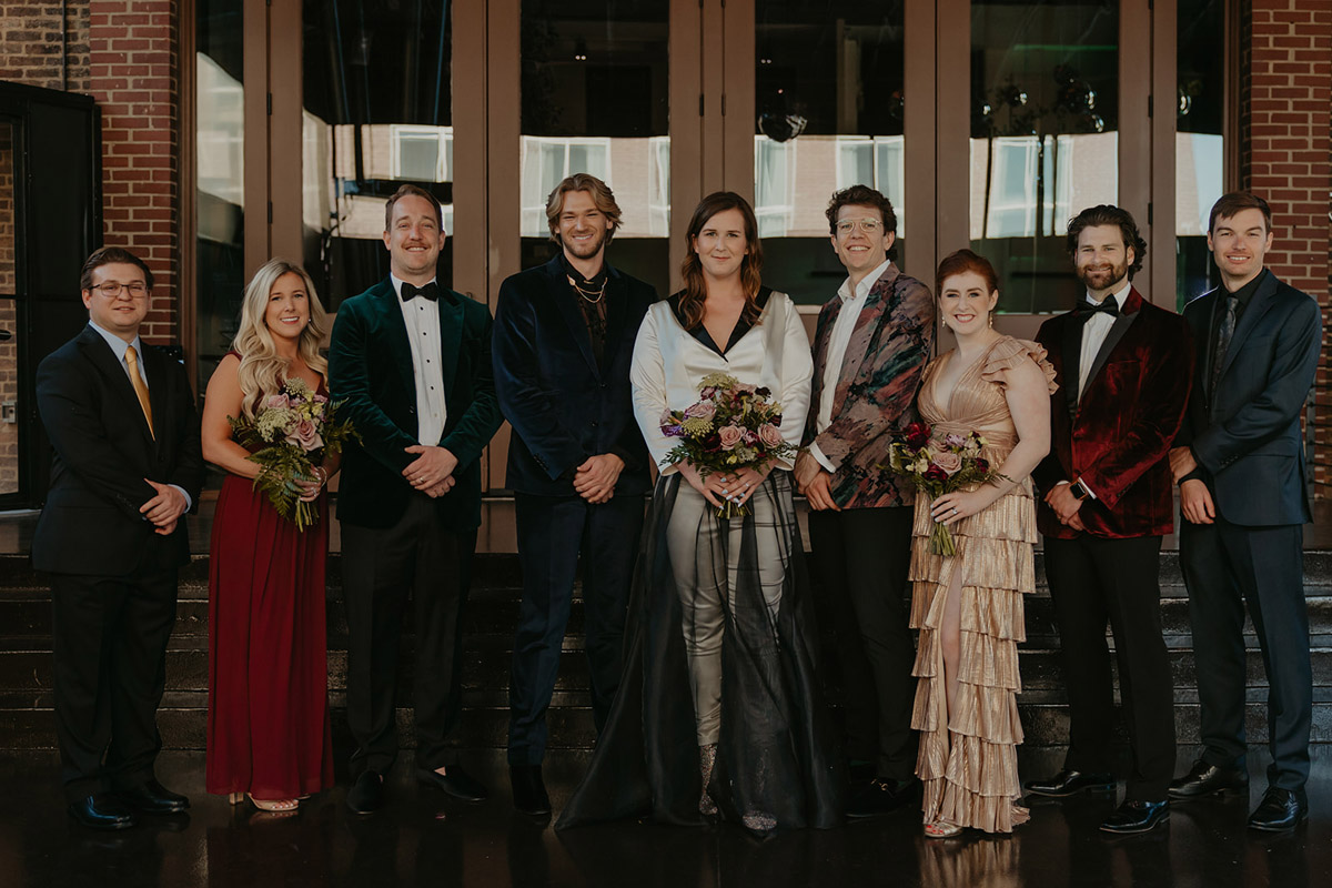 Marrier with their wedding party in stylish mixed colors and velvet