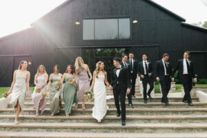bridal party photo in front of Nashville wedding venue, Saddle Woods Farm