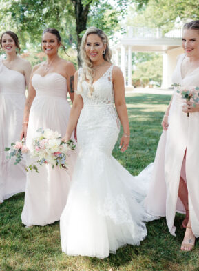 Bride Walking With Bridesmaids in Blush Dresses