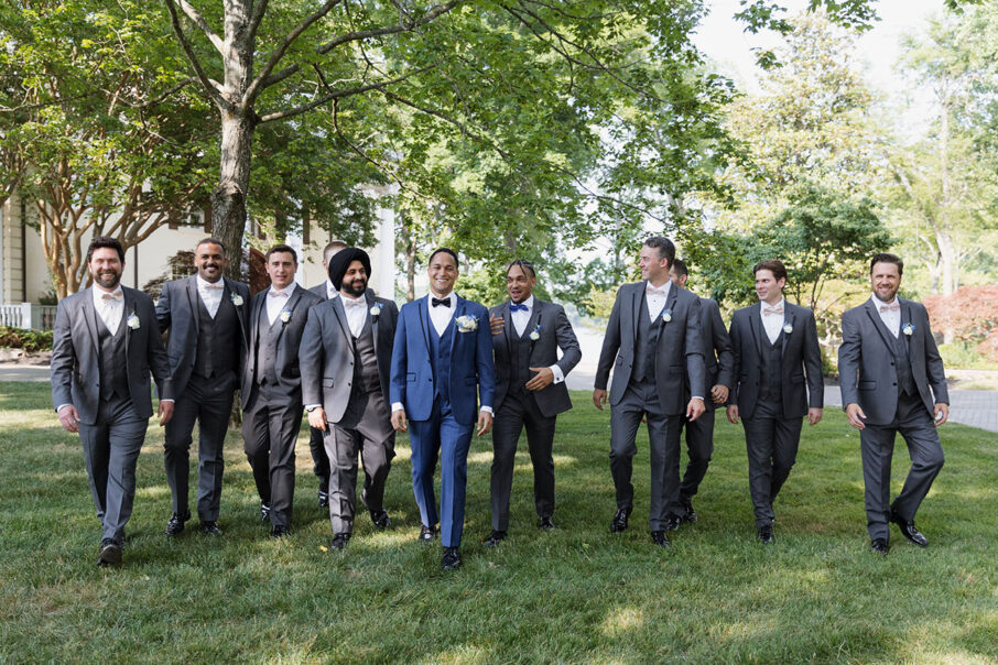 Groom Walking with His Groomsmen in Blue Tuxedo