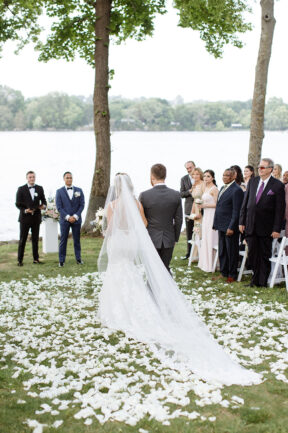 Bride Walking Down Aisle on White Rose Petals