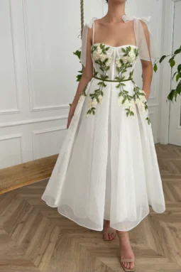 Cascading Ivy embroidering Teuta Matoshi dress for Folkore Era-inspired wedding rehearsal dinner