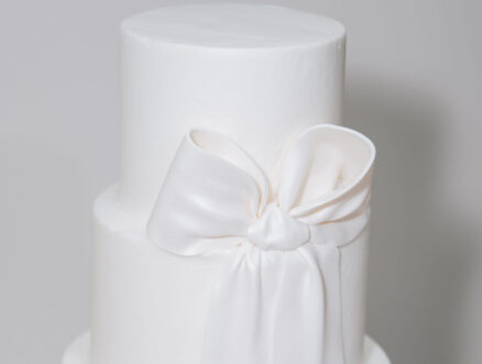 All White Three Tiered Wedding Cake with Bow